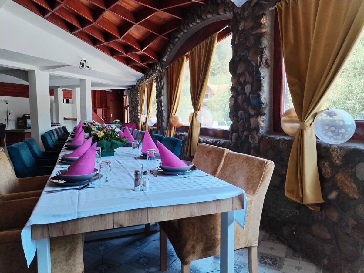 The large restaurant hall with a festively set table